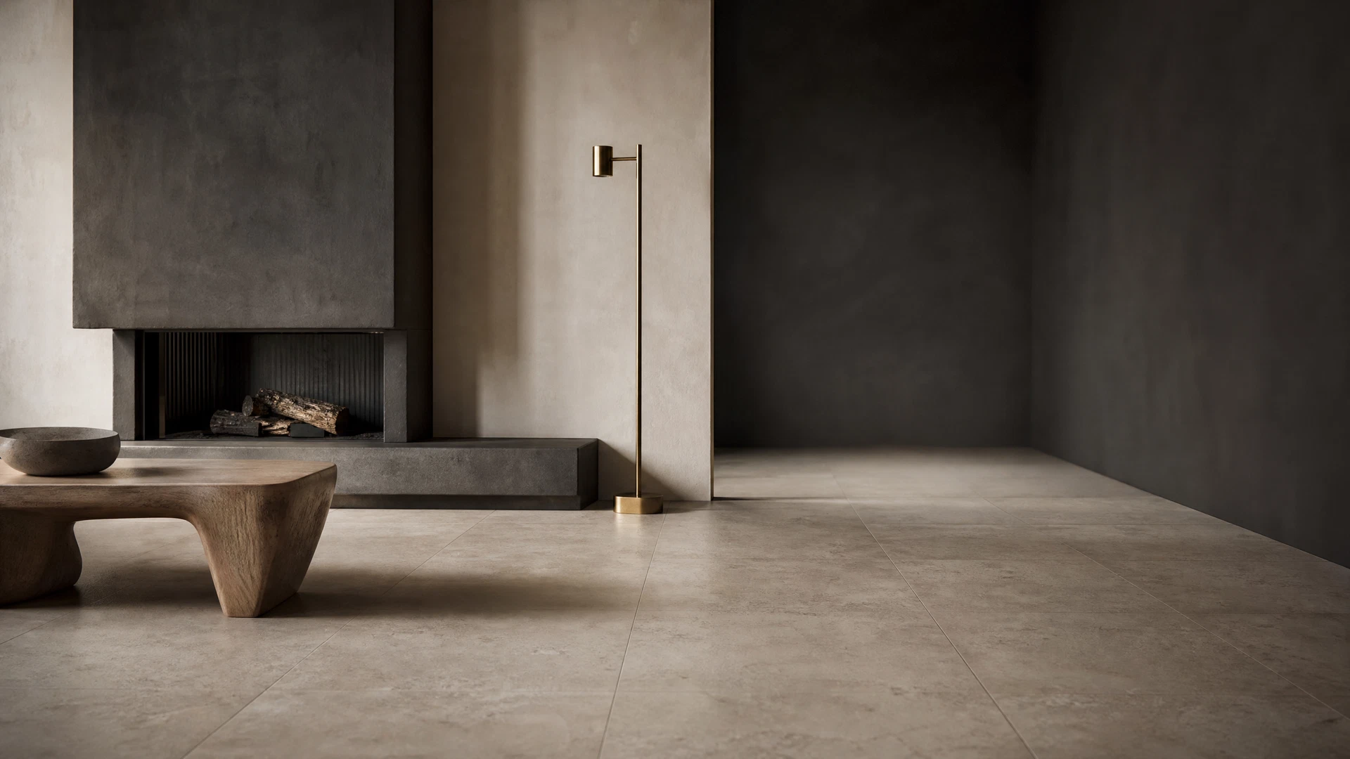 Interior with carefully aligned large-format tile flooring and a charcoal fireplace surround